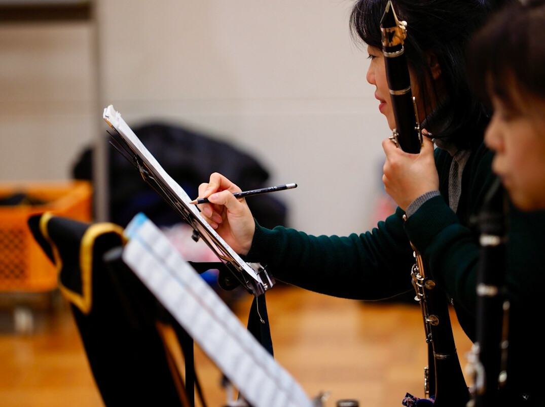 Coach guiding a client through a rehearsal with notes