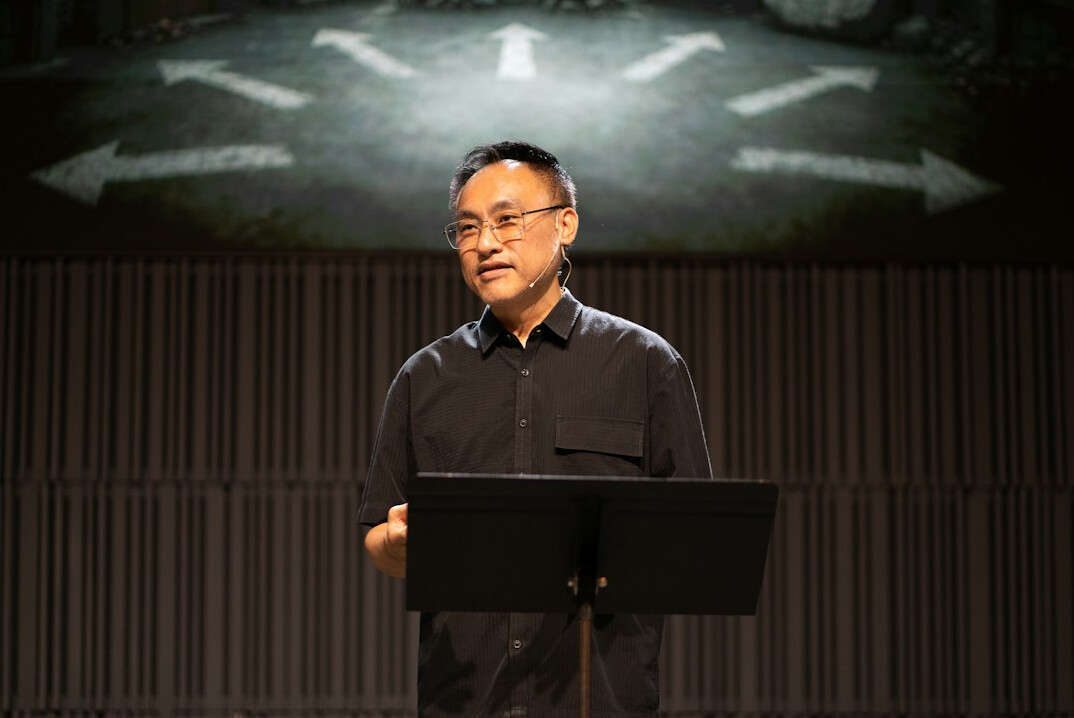 Business executive speaking confidently on a conference stage